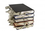 Dollars in the books, isolated on white background, business tra