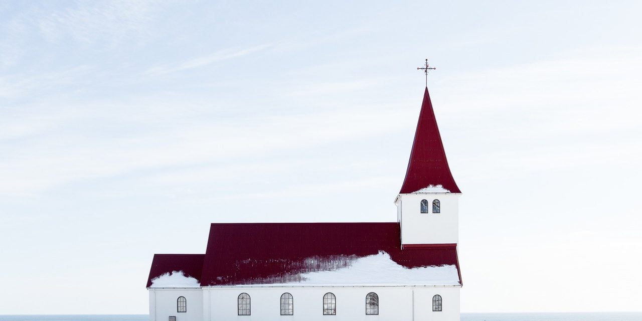 When owners of a religious institution acquire property zoned for religious assemblies which is later rezoned to exclude non-profit use, may they later construct a special occasions venue which does not charge fees for use?