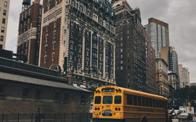 May a school district impose school impact fees on a development for university students without children?